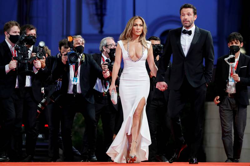 Jennifer Lopez, in a white couture gown by Lebanese designer Georges Hobeika, attends 'The Last Duel' with Ben Affleck.  Reuters