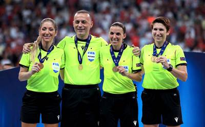 Match referee Stephanie Frappart (centre right), assistants Manuela Nicolosi (left) and Michelle O'Neill (right) with fourth official Cuneyt Cakir during the UEFA Super Cup Final at Besiktas Park, Istanbul. PA Wire