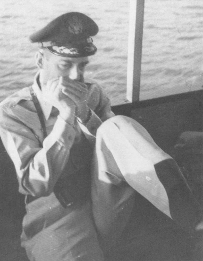 Mr Lansdale plays the harmonica while on deployment. Photo: American Folklife Centre, Library of Congress, Washington, DC.