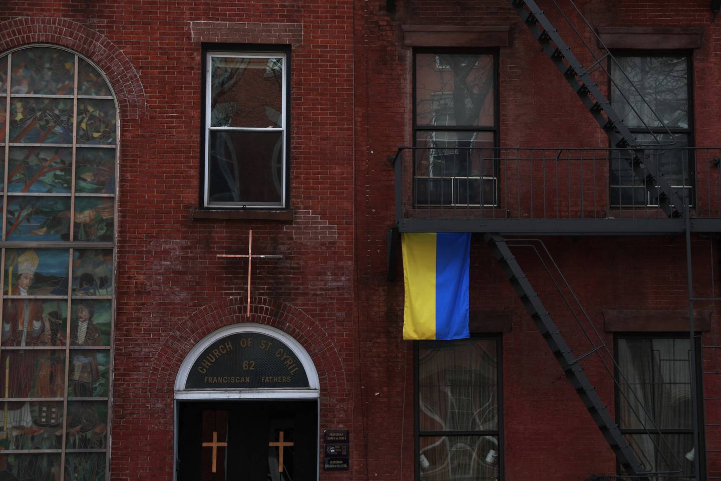 A flag of Ukraine hangs from the fire escape of a building, on the Lower East Side of New York City, on April 4. Reuters