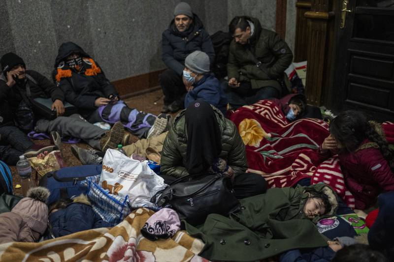 Afghans trying to flee Ukraine sleep inside Lviv railway station in west Ukraine. AP