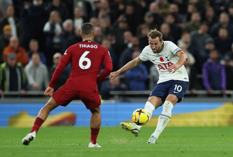 Tottenham's Harry Kane shoots under pressure from Liverpool's Thiago Alcantara. EPA