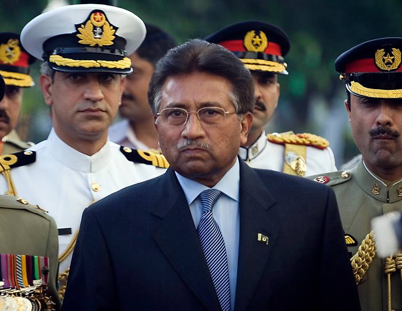 Former president Pervez Musharraf in 2008, surrounded by top military officers as he leaves the Presidential House in Islamabad.  AP Photo