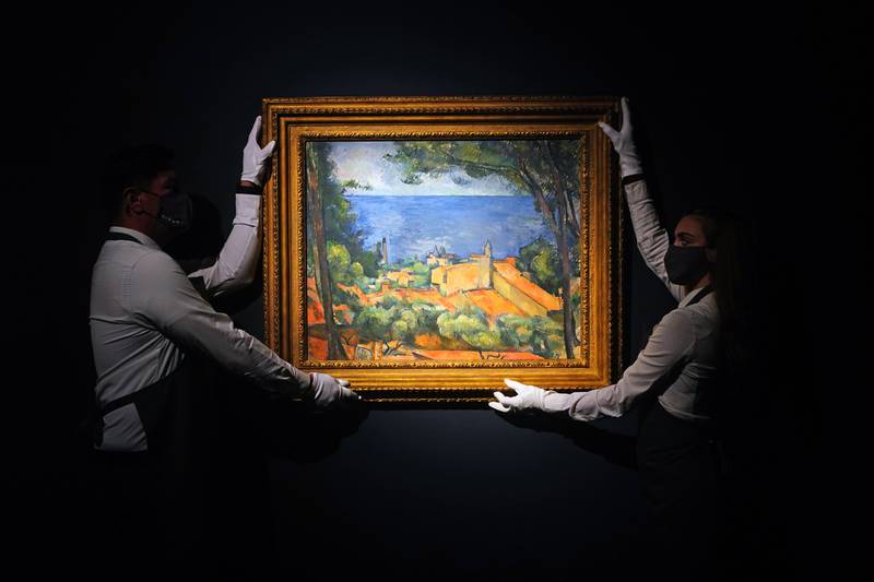 Art handlers hold The Bridge at Aix-en-Provence by Sir Winston Churchill, 1948, at Christie's in London. Christie's