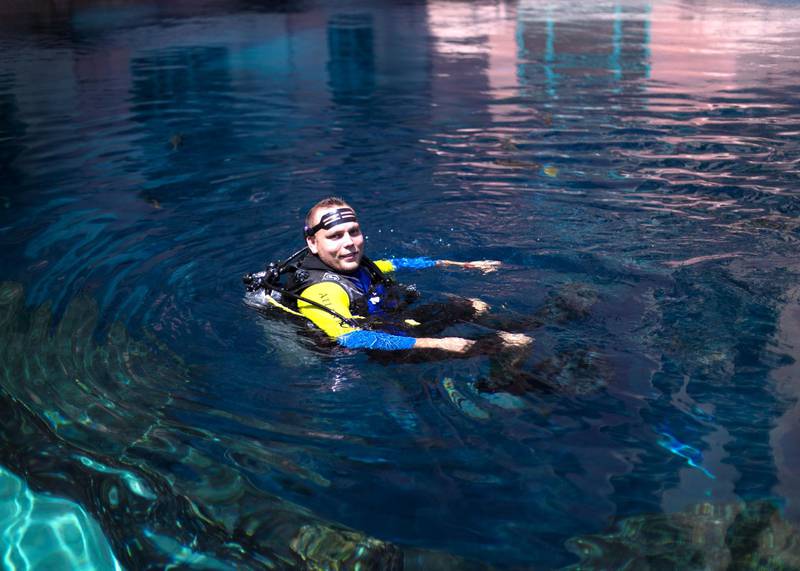DUBAI, UNITED ARAB EMIRATES - JULY 16 2019.Abdulla Yaulin, Uzbek diver at Atlantis who proposes to dozens of women from underwater at Ossiano every year.(Photo by Reem Mohammed/The National)Reporter: Section: AC
