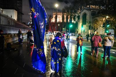 Anti-Brexit campaigners protest outside the Houses of Parliament in London. Getty Images