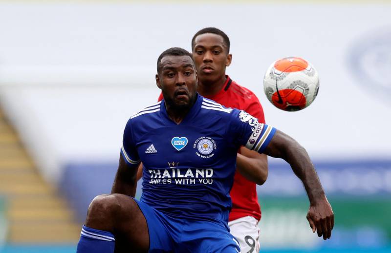 Leicester's Wes Morgan, front, duels for the ball with Manchester United's Anthony Martial. AP