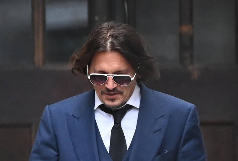 epa08532719 US actor Johnny Depp leaves the Royal Courts of Justice in London, Britain, 07 July 2020. Depp is suing The Sun's newspaper publisher News Group Newspapers (NGN) over claims he abused his ex-wife, US actress Amber Heard, reports state.  EPA/FACUNDO ARRIZABALAGA