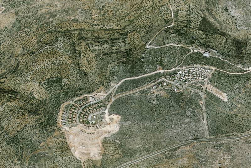 A handout photo made available by the Peace Now organization showing an aerial view of the Israeli settlement of Bruchin in the West Bank.  EPA