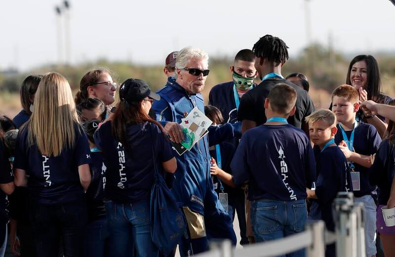 Virgin Galactic founder Richard Branson is greeted by schoolchildren before boarding the rocket plane at Spaceport America, New Mexico.