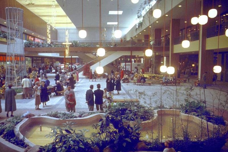 Shoppers in interior Garden Court view of upper level in Southdale Regional Shopping Center, the first indoor mall in America. Grey Villet / The Life Picture Collection / Getty Images