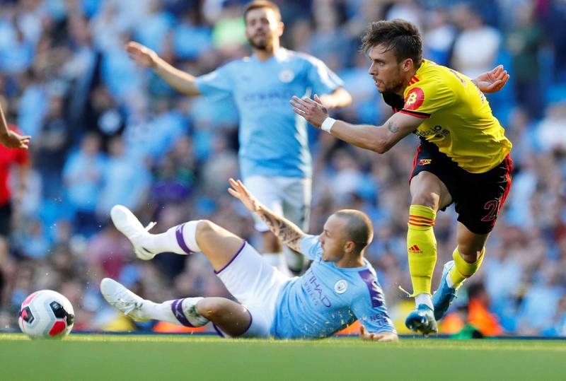 Watford's Kiko Femenia in action with Manchester City's Angelino. Reuters