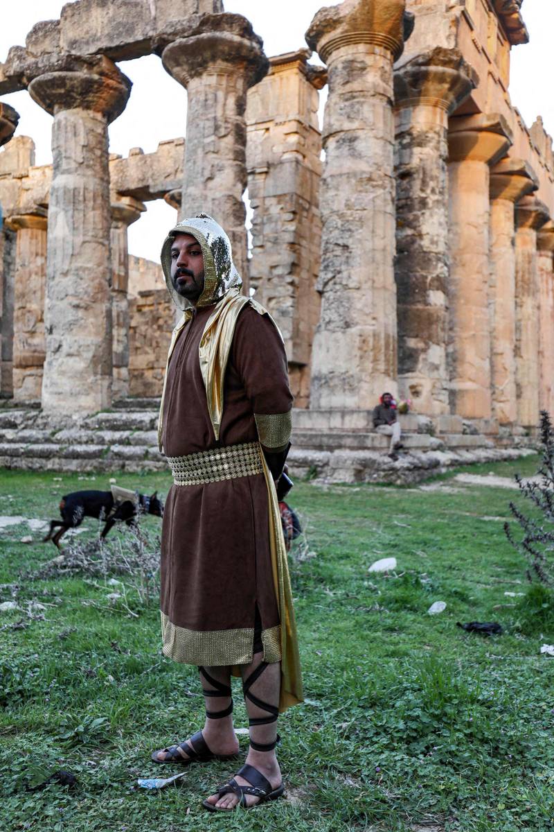 A actor in costume stands near the Temple of Zeus in the ruins of Libya's ancient eastern city of Cyrene during the filming of a television production. AFP