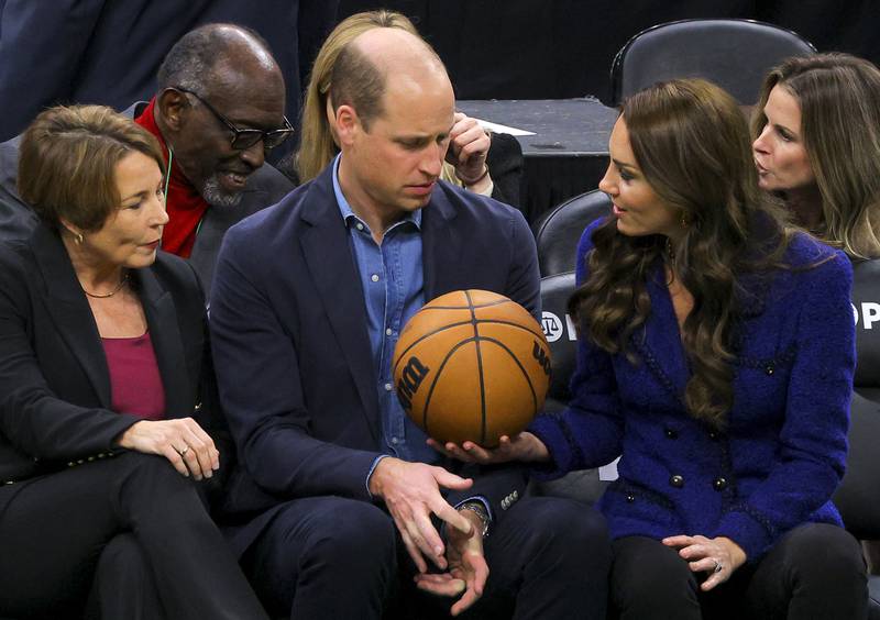 Massachusetts governor-elect Maura Healey looks on as Britain's Prince William is handed a basketball by his wife Kate at a Boston Celtics game. AP