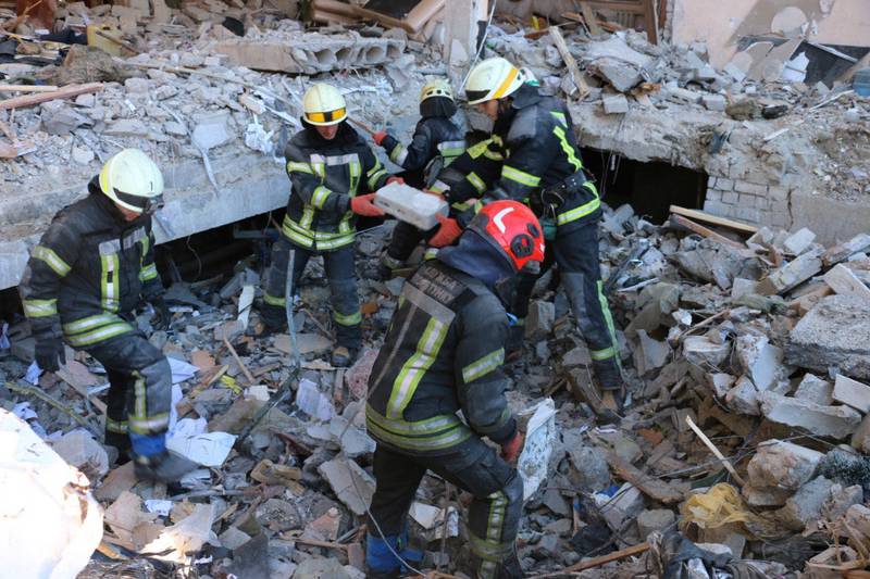 Rescuers conduct search operations and dismantle debris in Kharkiv, Ukraine. AFP