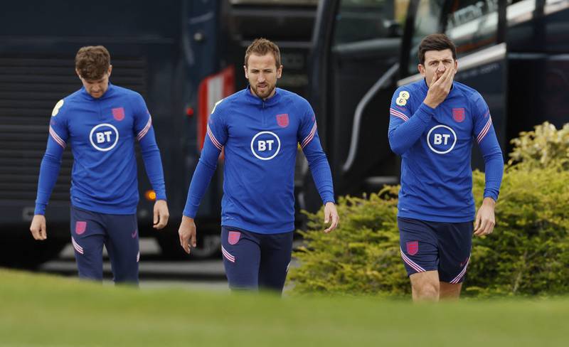 Left to right: England's John Stones, Harry Kane and Harry Maguire arrive at training. Reuters