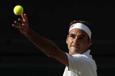 LONDON, ENGLAND - JULY 12: Roger Federer of Switzerland serves in his Men's Singles semi-final match against Rafael Nadal of Spain during Day eleven of The Championships - Wimbledon 2019 at All England Lawn Tennis and Croquet Club on July 12, 2019 in London, England. (Photo by Adrian Dennis - Pool/Getty Images)