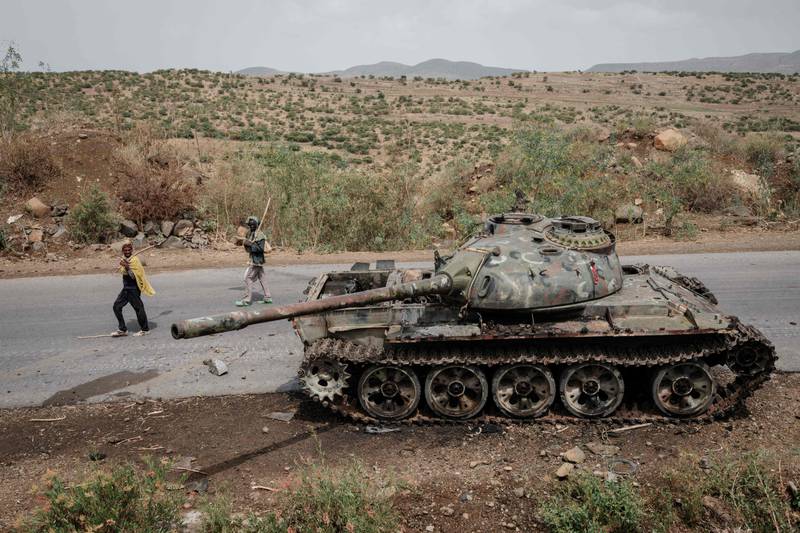 The hulk of a tank, purportedly belonging to the  Eritrean Army, sits on a road in Dansa, south-west of Mekele in Tigray region, Ethiopia. AFP
