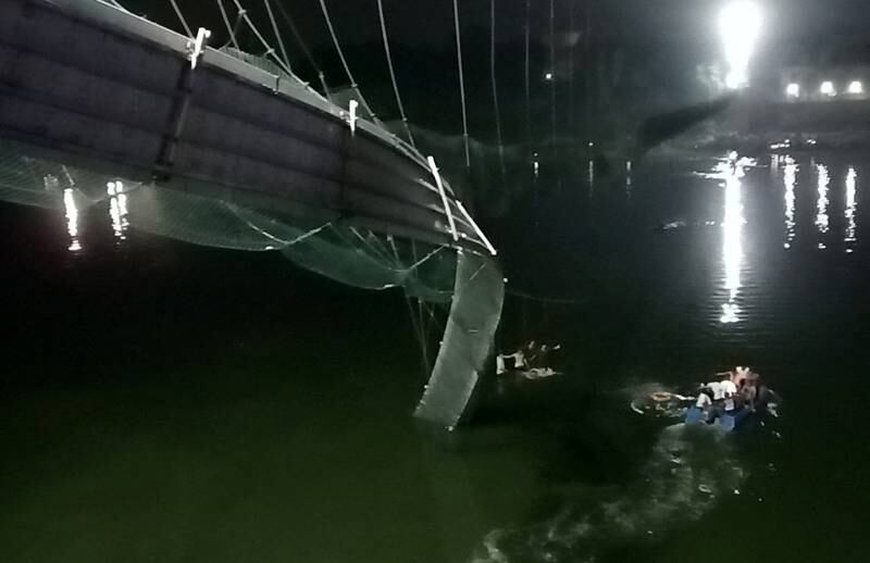 The damaged suspension bridge, which crosses the Machchhu river. Dozens are feared dead and several injured. Reuters