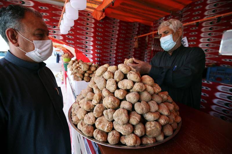 A Kuwaiti vendor displays a pile of desert truffles at a market in Kuwait City. Rains in early winter can bring an abundance of 'Terfeziaceae' fungi months later. AFP