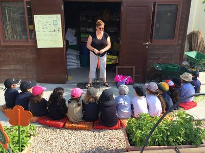 Children at American School Dubai learn about gardening tools. Courtesy Home Grown Children’s Eco Nursery