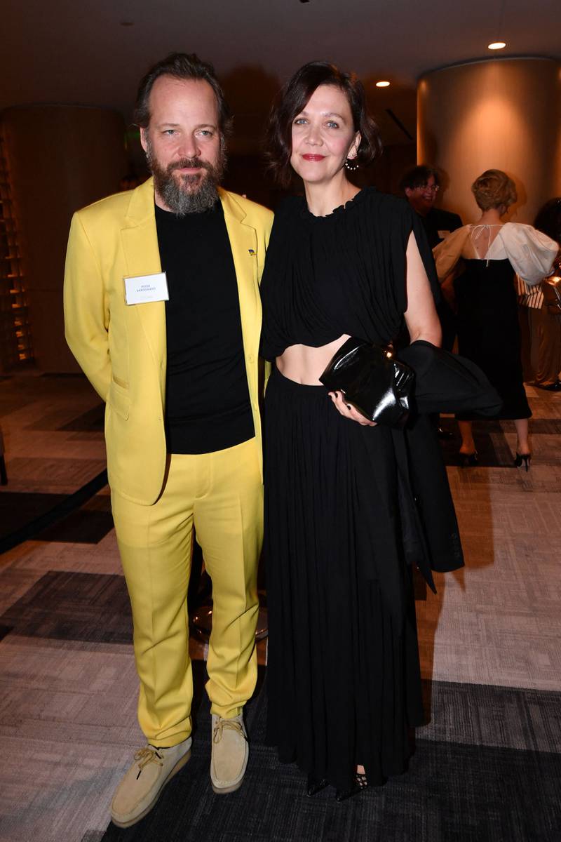 US actress and filmmaker Maggie Gyllenhaal, left, and her husband, US actor Peter Sarsgaard. AFP