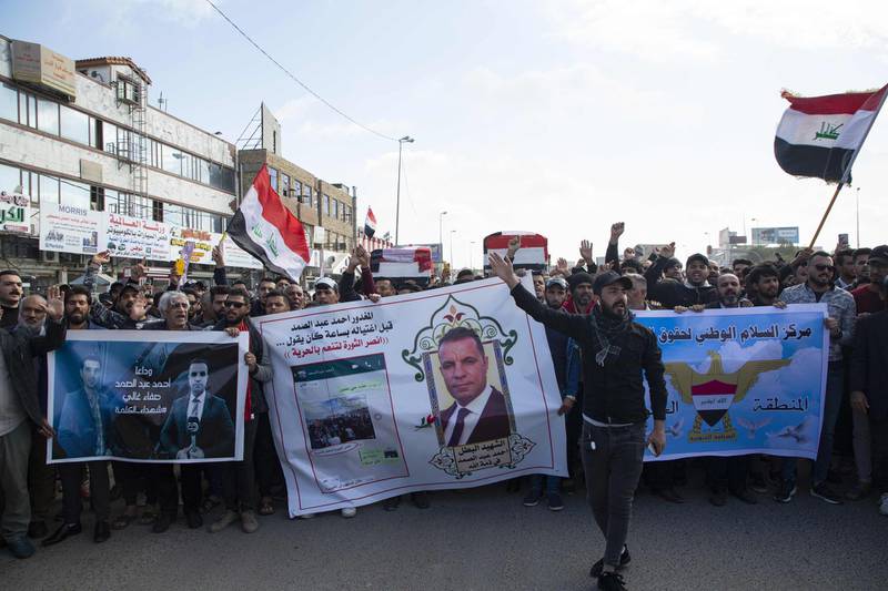Iraqis carry mock coffins as they take part in a rally to mourn Ahmad Abdessamad, a correspondent for local television station Al-Dijla, and his cameraman Safaa Ghali were shot dead late Friday in Basra. AFP