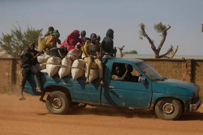People travel past Government Science Secondary School in Kankara, Nigeria. AP Photo