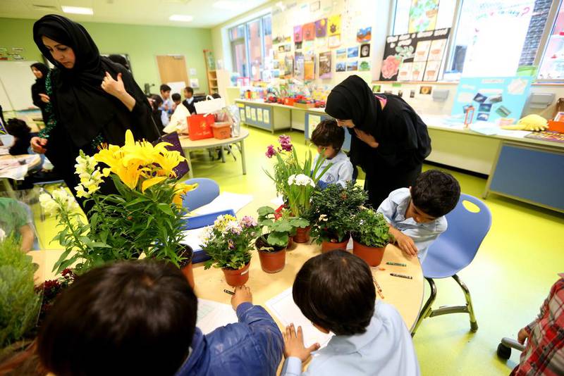 Teachers have found that children become more engaged in their lessons when their parents are in the classroom, such as this lesson in how plants grow at the Mubarak bin Mohammed School in Abu Dhabi. Fatima Al Marzooqi / The National
