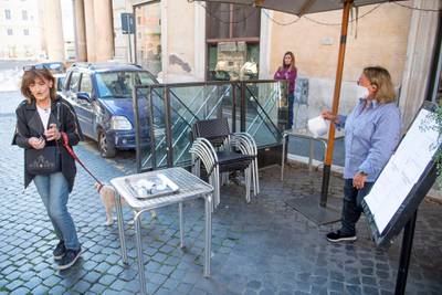 A customer picks up Italian breakfast at a bar in  Rome. EPA