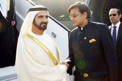 Sheikh Mohammed bin Rashid, Vice President of the UAE and Ruler of Dubai, is greeted by Shashi Tharoor, the Indian minister of state for external affairs, at the Indira Gandhi International Airport in New Delhi.