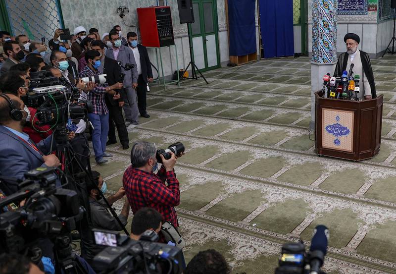 Ebrahim Raisi gives a news conference after voting in the presidential election, at a polling station in Tehran.