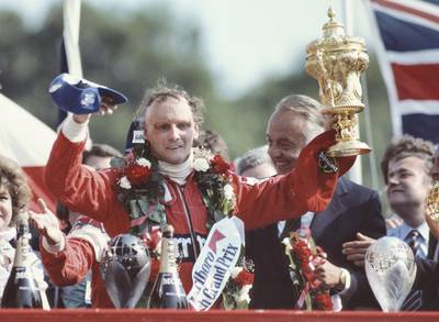 Niki Lauda of Austria and driver of the #8 Marlboro McLaren International McLaren MP4B Ford Cosworth DFV V8 lifts the RAC Trophy and celebrates winning the Marlboro British Grand Prix on 18 July 1982 at the Brands Hatch circuit in Fawkham, Great Britain. (Photo by Adrian Murrell/Getty Images) 