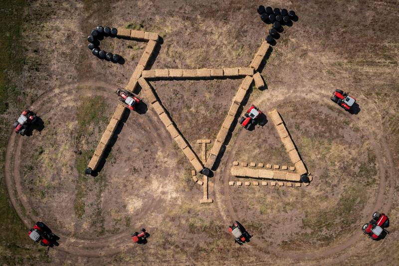 Aerial view shows tractors and straw bales forming a bike-shaped land art sculpture along the route of the third stage of the Tour de France cycling race, in Jutland, Denmark. AFP