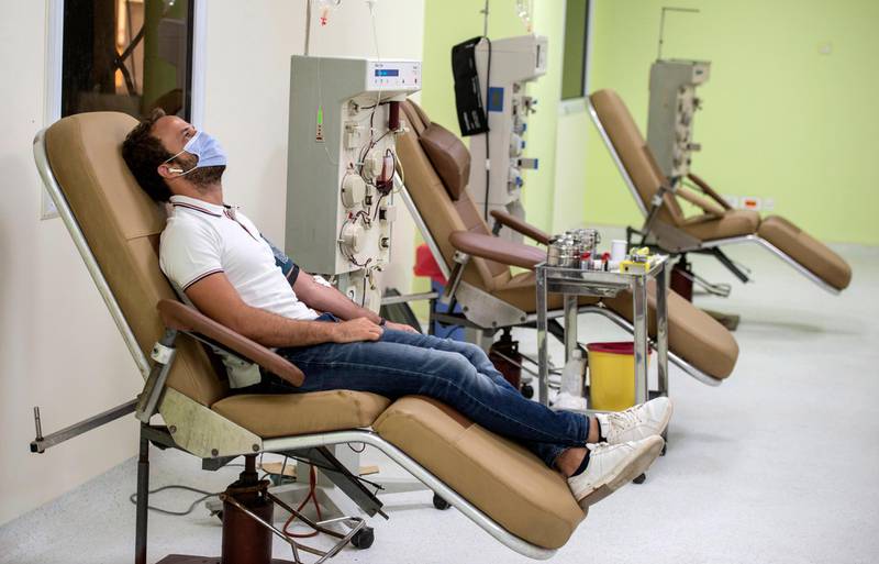 A patient who recovered from Covid-19, donates his blood plasma at Vacsera, an Egyptian pharmaceutical company, in Cairo, Egypt.  EPA