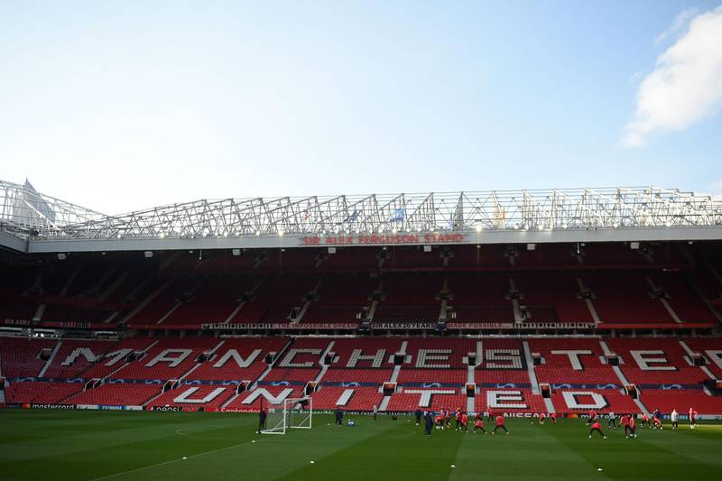 Barcelona's players attend a training session at Old Trafford stadium in Manchester, north west England on the eve of their UEFA Champions League quarter final first leg football match against Manchester United.  AFP