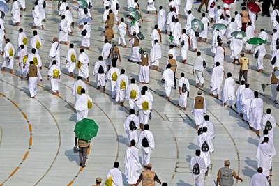 A picture shows pilgrims circumambulating around the Kaaba, the holiest shrine in the Grand mosque in the holy Saudi city of Mecca, on July 31, 2020 during the annual Muslim Hajj pilgrimage. (Photo by STR / AFP)