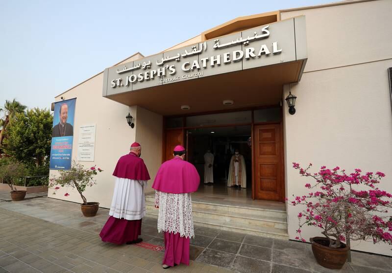 Bishop Paolo Martinelli, right, arrives at St Joseph's Cathedral in Abu Dhabi to be installed as the new Apostolic Vicar for Southern Arabia. He is accompanied by the outgoing holder of the post, Bishop Paul Hinder. All photos: Chris Whiteoak / The National