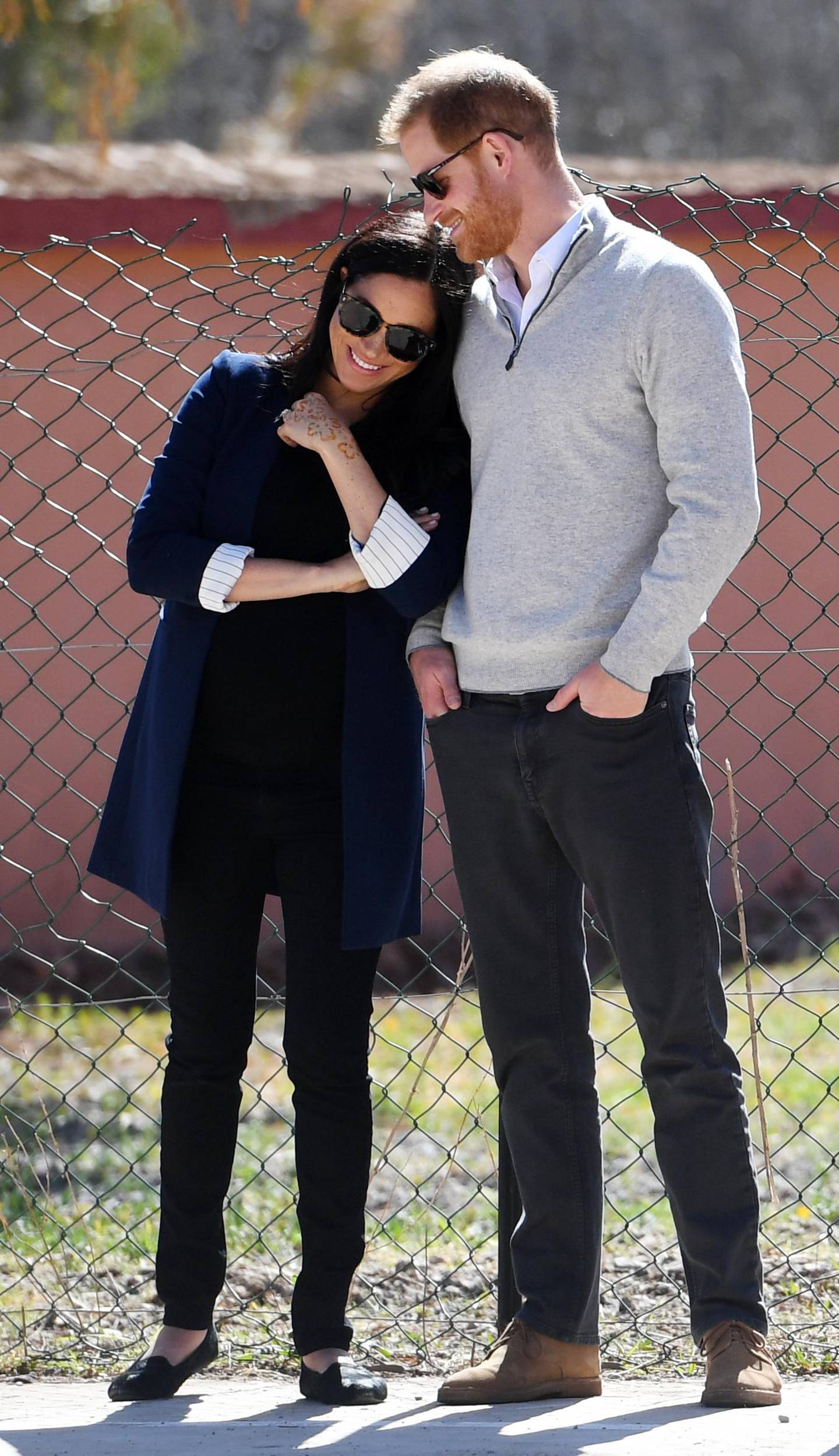 ASNI, MOROCCO - FEBRUARY 24:   Meghan, Duchess of Sussex and Prince Harry, Duke of Sussex watch students play football during their visit to LycÃ©e Qualifiant Grand Atlas, the local secondary school on February 24, 2019 in Asni, Morocco.  (Photo by Facundo Arrizabalaga - Pool/Getty Images)