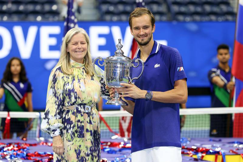 Daniil Medvedev of Russia celebrates with the championship trophy alongside Stacey Allaster, USTA Executive Chie. AFP