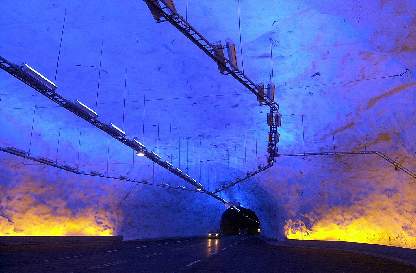 Cars drive through the tunnel in Laerdal, Norway on November 27, 2000, after it was officially opened. 