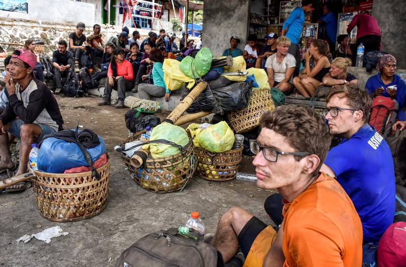 REFILE - CORRECTING GRAMMAR Indonesian and foreign climbers are seen after walking down from Rinjani Mountain at Sembalun village in Lombok Timur, Indonesia, July 29, 2018. Picture taken July 29, 2018. Antara Foto/Ahmad Subaidi/via REUTERS -  ATTENTION EDITORS - THIS IMAGE WAS PROVIDED BY A THIRD PARTY. MANDATORY CREDIT. INDONESIA OUT.