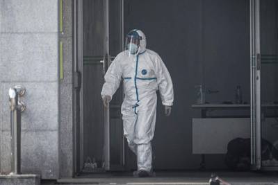 A medical staff member walks outside the Jinyintan hospital, where patients infected by a mysterious SARS-like virus are being treated, in Wuhan in China's central Hubei province on January 18, 2020. The true scale of the outbreak of a mysterious SARS-like virus in China is likely far bigger than officially reported, scientists have warned, as countries ramp up measures to prevent the disease from spreading. - China OUT
 / AFP / STR
