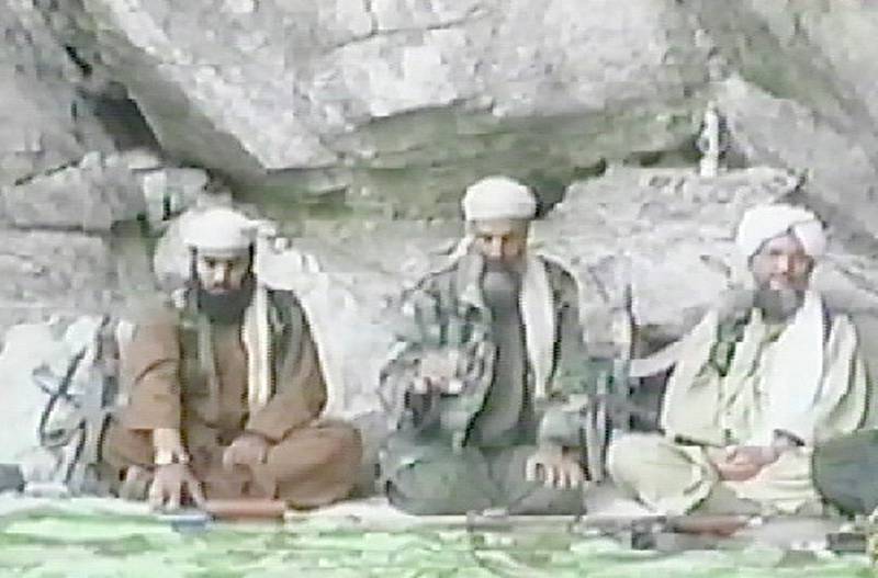 From left, Al Qaeda spokesman Suleiman Abu Ghaith, bin Laden and Al Zawahiri appear in a video aired by Al Jazeera TV station in October 2001, at an undisclosed location in Afghanistan. In the video, bin Laden praised the 9/11 attacks and said the US would not know peace until it withdrew its troops from the Middle East. AFP