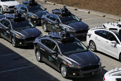 Self-driving Uber vehicles position themselves during a media preview at Uber's Advanced Technologies Center in Pittsburgh. Gene J Puskar / AP Photo