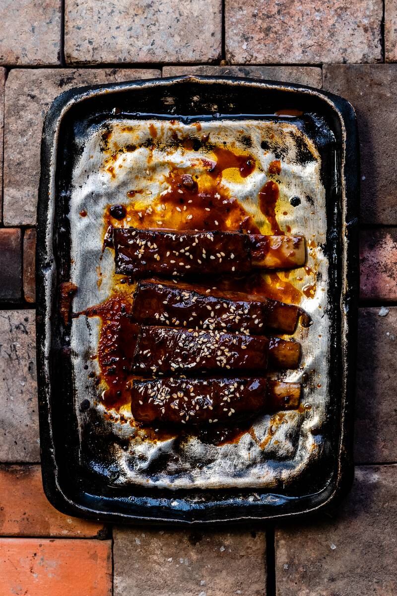 Lamb ribs with Asian barbecue sauce and coriander.