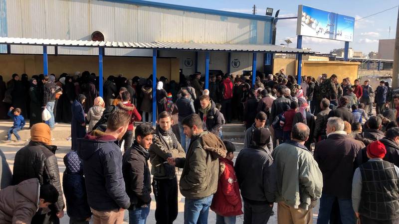 ALEPPO, SYRIA - FEBRUARY 21: People wait in long queues in front of a bakery to buy bread as the Bashar al-Assad regime, which is incapable of meeting the basic needs of the people living in the regions it controls in Syria, cannot prevent a bread crisis from worsening, in Aleppo, Syria on February 21, 2021. (Photo by Ula Muhammed/Anadolu Agency via Getty Images)