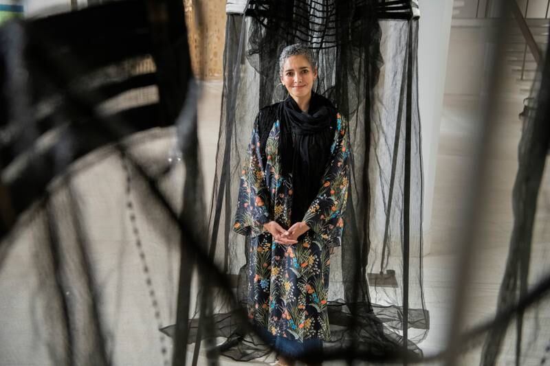 Saudi artist Filwa Nazer with her work 'The Other Is Another Body 2' (2019), which is on view at Misk Art Week. Photo: Misk Art Institute