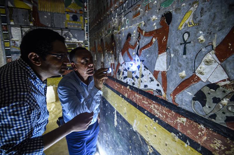 Mohamed Mujahid, head of the Egyptian team that discovered the tomb, inspects the interior. AFP