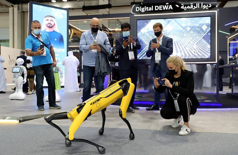 DUBAI, UNITED ARAB EMIRATES, December 8 – Visitors looking at the four-legged Spot Robot at the DEWA stand on the third day of GITEX Technology Week held at Dubai World Trade Centre in Dubai. (Pawan Singh / The National) For News/Online.